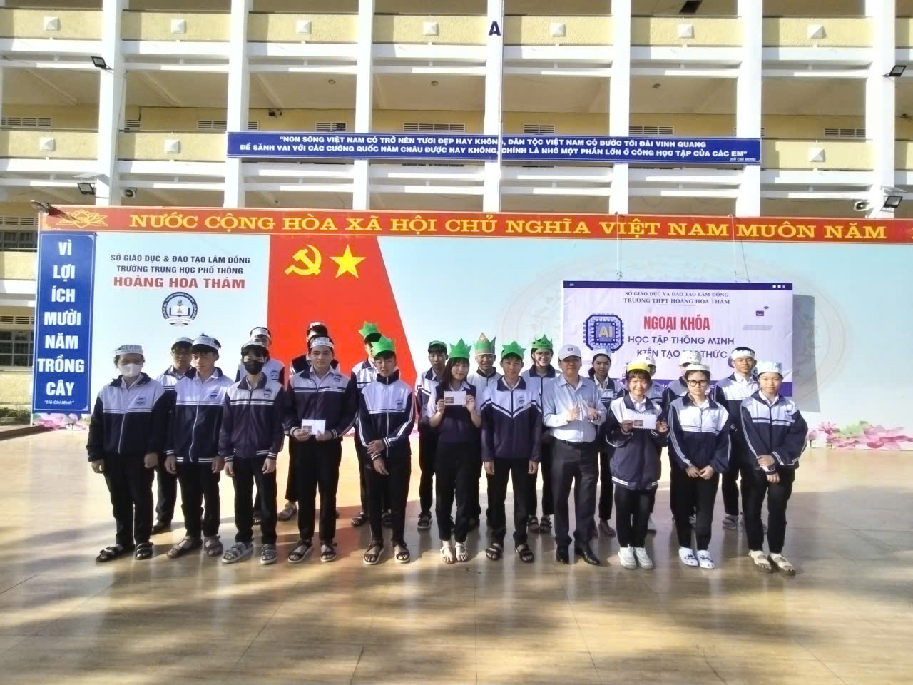 '''''A group of people standing in front of a banner
AI-generated content may be incorrect.'''''