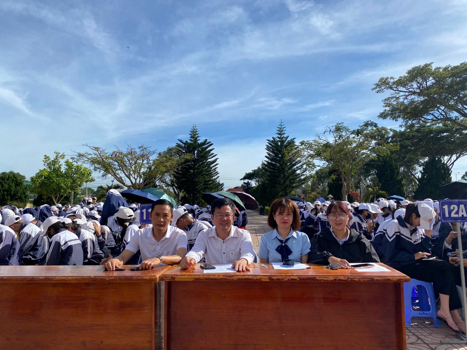 '''''A group of people sitting at a desk
AI-generated content may be incorrect.'''''