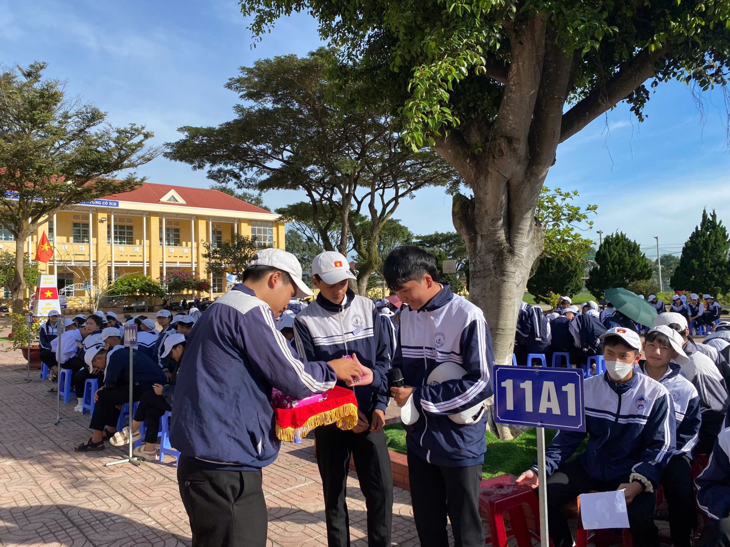 '''''A group of people standing outside
AI-generated content may be incorrect.'''''